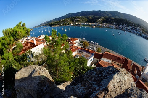 High angle fisheye view of Poros town in Greece in the evening, seen from the bottom of the clock tower