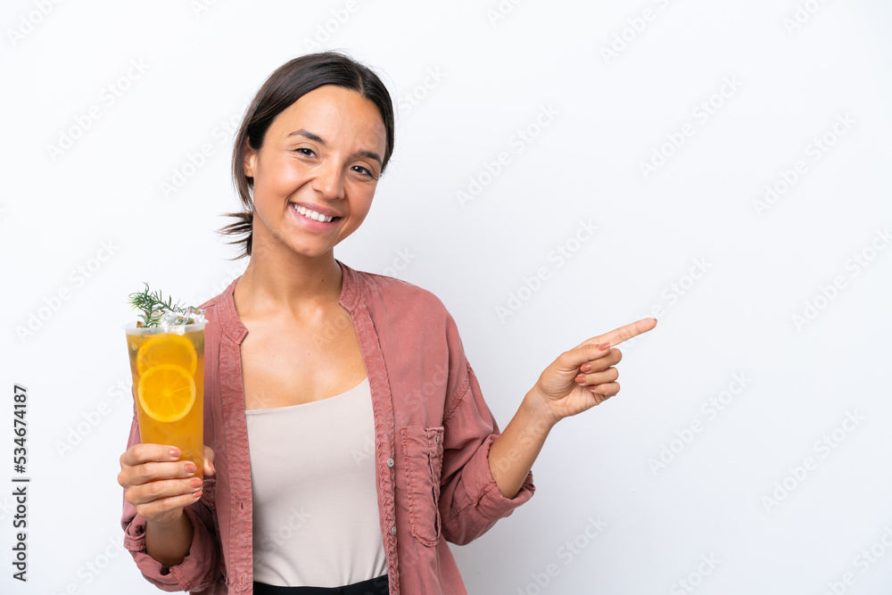 Young hispanic woman holding a cocktail isolated on white background pointing finger to the side Young hispanic woman holding a cocktail isolated on white background pointing finger to the side