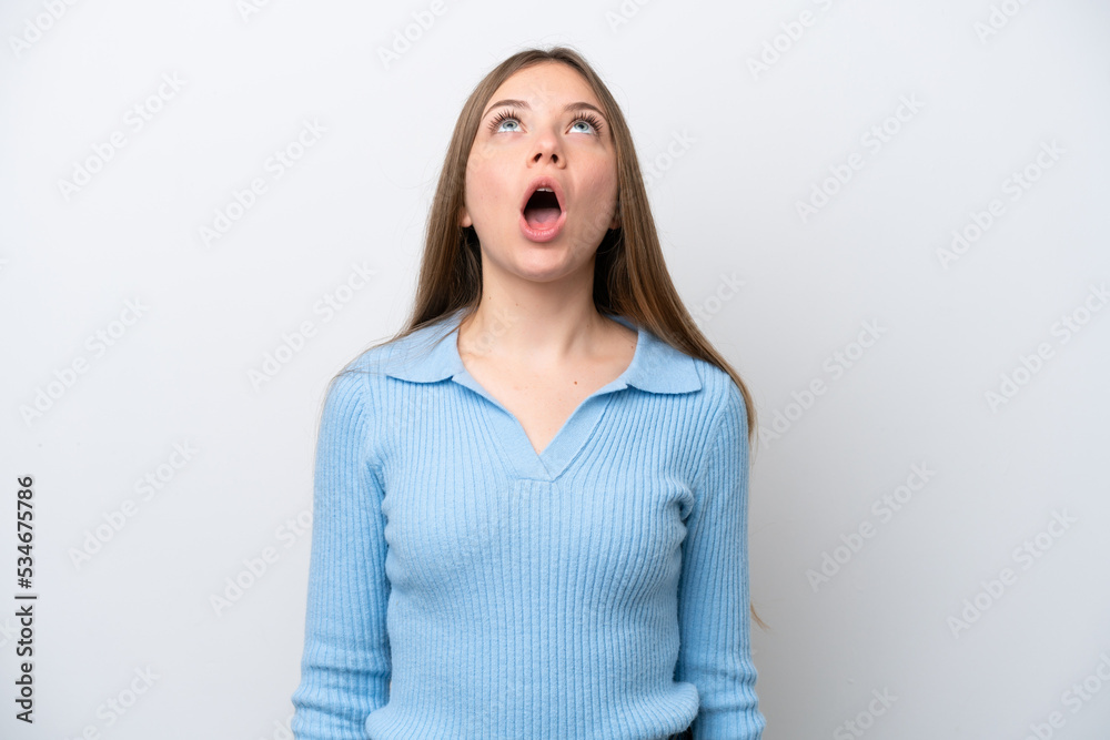 Young Lithuanian woman isolated on white background looking up and with surprised expression Young Lithuanian woman isolated on white background looking up and with surprised expression