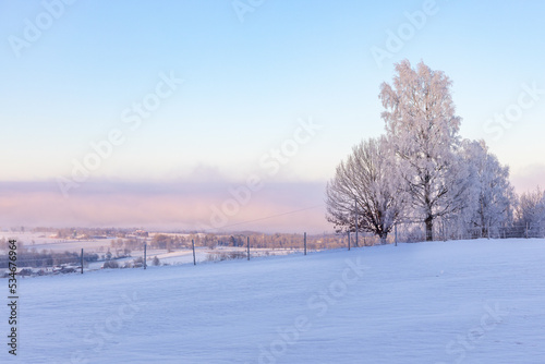 Snowy field with a view at the countryside © Lars Johansson