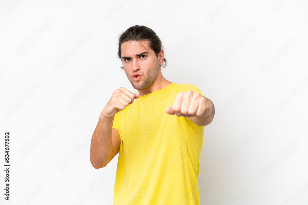 Caucasian handsome man isolated on white background with fighting gesture Caucasian handsome man isolated on white background with fighting gesture