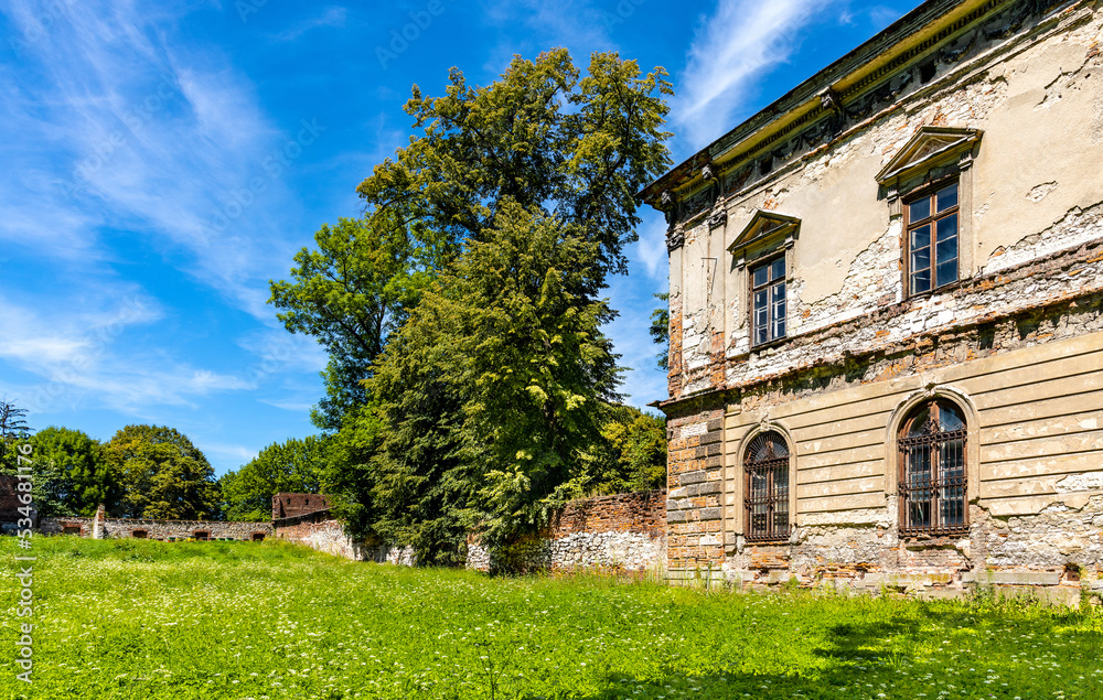 Ruined renaissance and baroque historic castle complex with palace and garden in old town quarter of Pilica in Silesia region in Poland Ruined renaissance and baroque historic castle complex with palace and garden in old town quarter of Pilica in Silesia region in Poland
