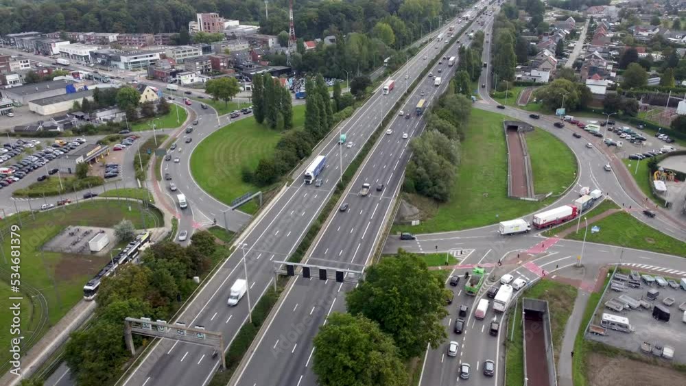 Fast forward video of busy roundabout and highway in Wommelgem, Antwerp. Drone aerial speed up video Fast forward video of busy roundabout and highway in Wommelgem, Antwerp. Drone aerial speed up video