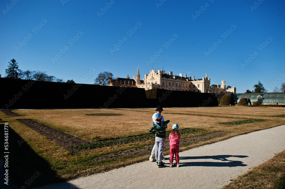 Obraz premium Three kids walking at Lednice park, Czech Republic.