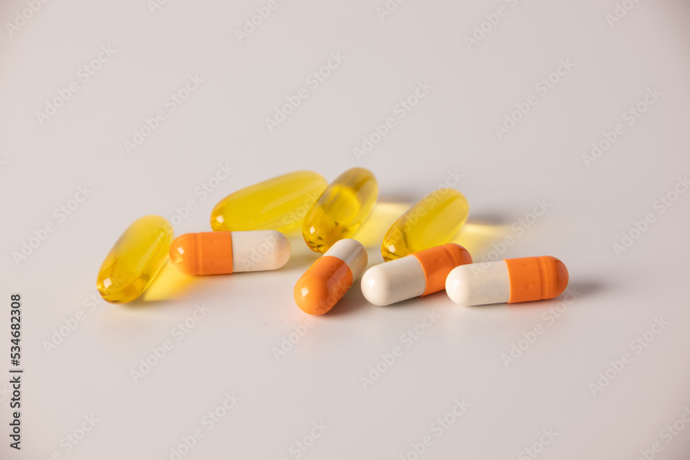 Tablets, medications on a white background, a scattering of tablets Tablets, medications on a white background, a scattering of tablets