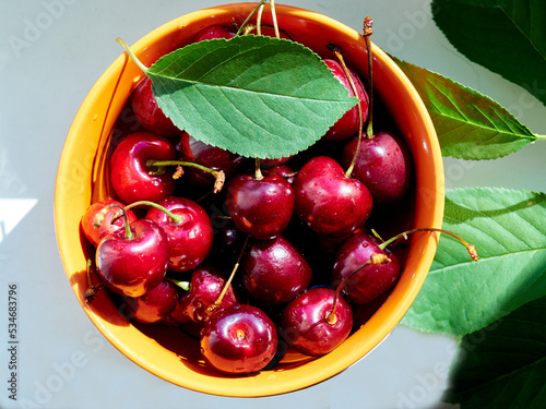 Ripe red cherries in a bowl