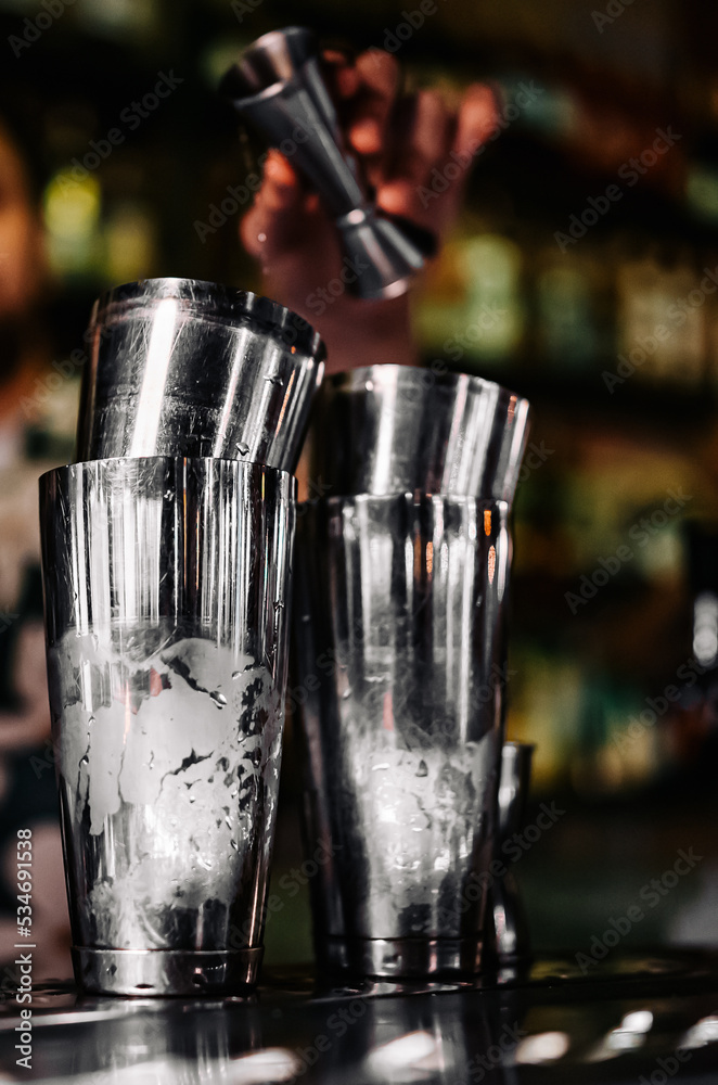man bartender making cocktail in bar man bartender making cocktail in bar