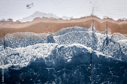 Hel peninsula with snow on beach, Baltic Sea in winter photo