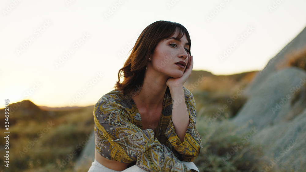 Sad Girl Sitting on a Lonely Rock in Summer. Sad Girl Sitting on a Lonely Rock in Summer.