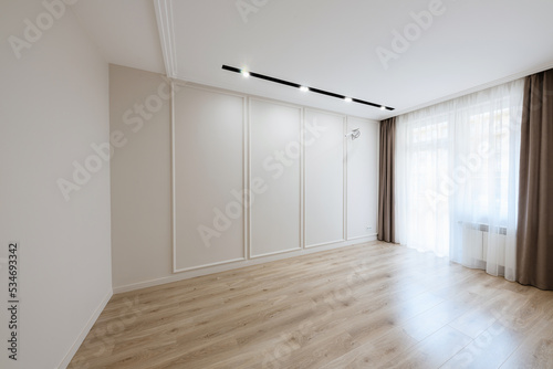 interior design of an empty room with a large window in a new bright house