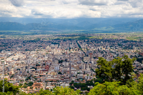 Cerro San Bernardo viewpoint over the city of Salta in Argentina. Along straight streets, buildings extend through the valley.