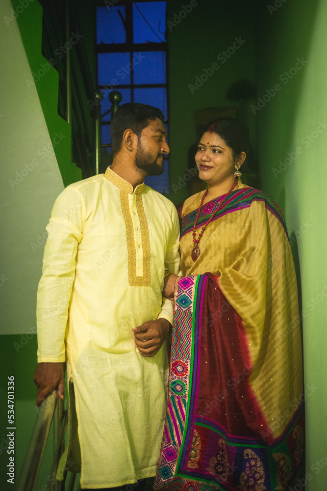 Fototapeta premium South asian hindu religious newly married young couple having post wedding chill . 