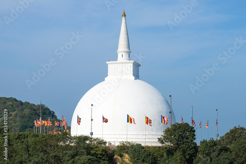 Ancient Buddhist stupa f Mahaseya Dagoba close-up on a sunny morning. Mihintale, Sri Lanka photo