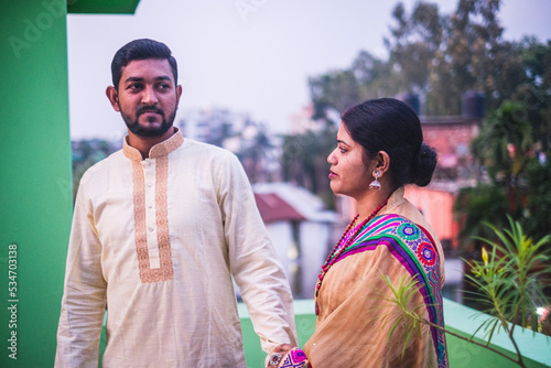 South asian hindu religious newly married young couple having post wedding chill .  