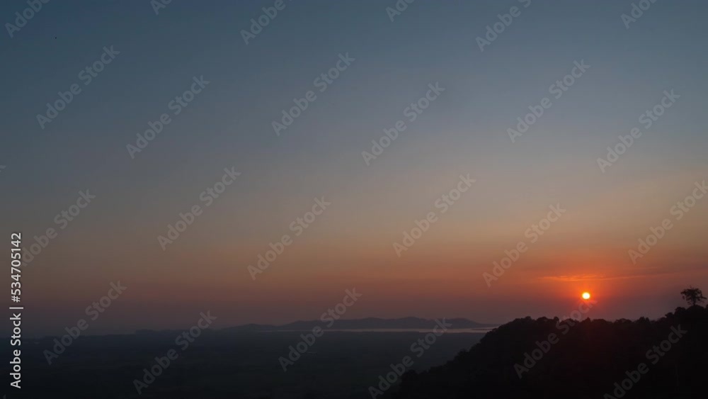 Sunset time lapse over hills and mountain ranges background. Beautiful nature scenery. Environmental background Sunset time lapse over hills and mountain ranges background. Beautiful nature scenery. Environmental background