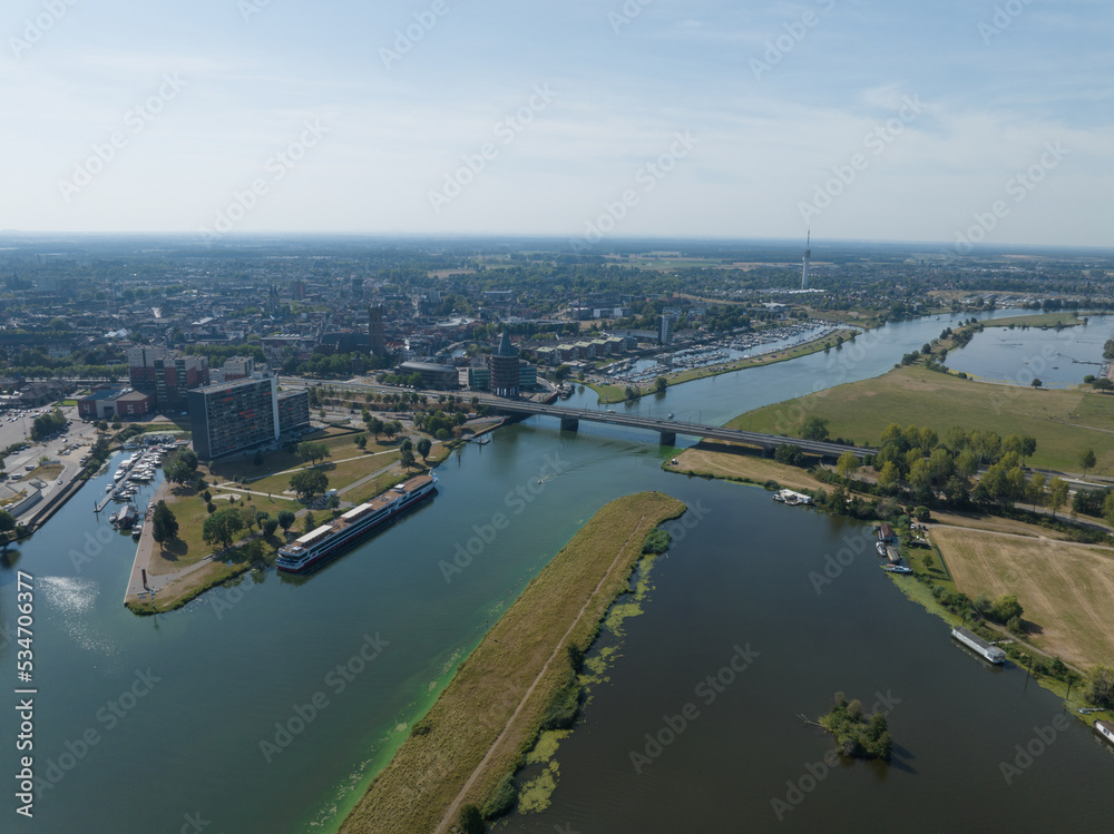 Skyline of Roermond town in the Dutch province of Limburg.Along Roer and the Maas waterway. Infrastructure and fly over. Urban city center.