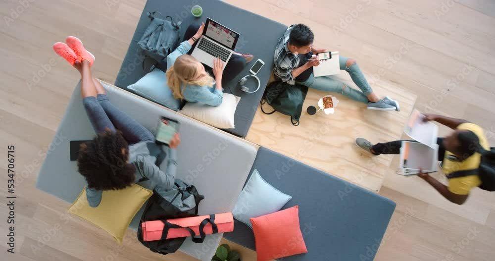Business, collaboration and teamwork by team working in creative startup from above, trendy office space. Overhead of design partner data analysis and paper planning with report and document on floor