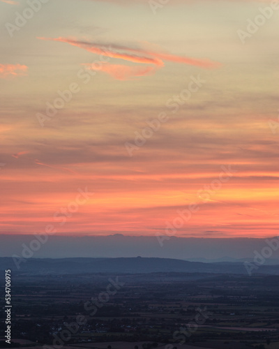Sunset over May Hill Gloucestershire, taken from Cleeve Common photo