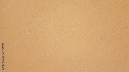 Orange painted plaster wall.