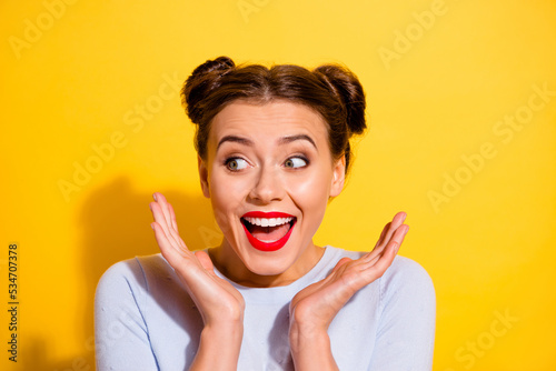 Portrait of cheerful impressed female see huge black friday bargains promotion isolated on yellow color background