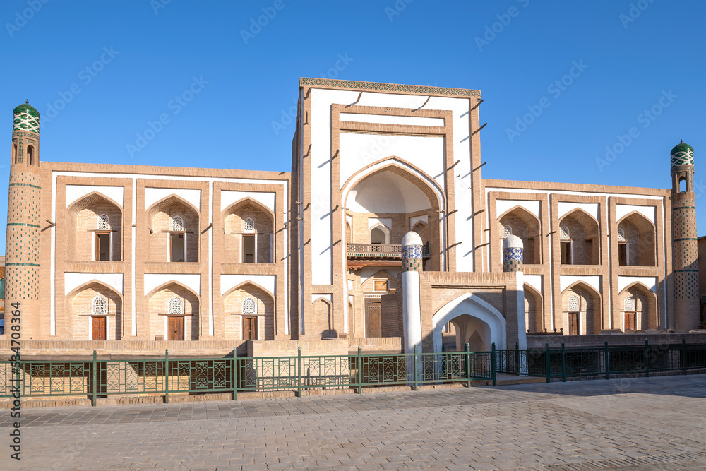Ancient madrasah of Amir-Tour on a sunny day. Khiva, Uzbekistan