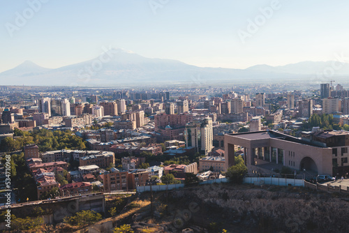 Yerevan, Armenia, beautiful super-wide angle panoramic view of Yerevan with Mount Ararat, cascade complex, mountains and scenery beyond the city, summer sunny day photo