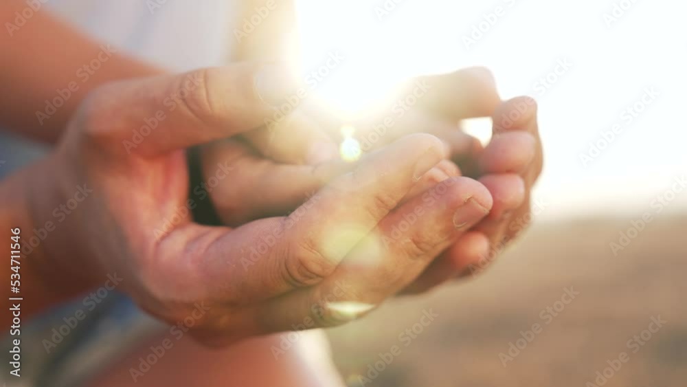 Happy family concept. Mom takes care of child. People hands at sunset. Dad holds little hands of girl in his hand. Care and safety in family.Parent supports child.Dad hands stroking little girl hands Happy family concept. Mom takes care of child. People hands at sunset. Dad holds little hands of girl in his hand. Care and safety in family.Parent supports child.Dad hands stroking little girl hands