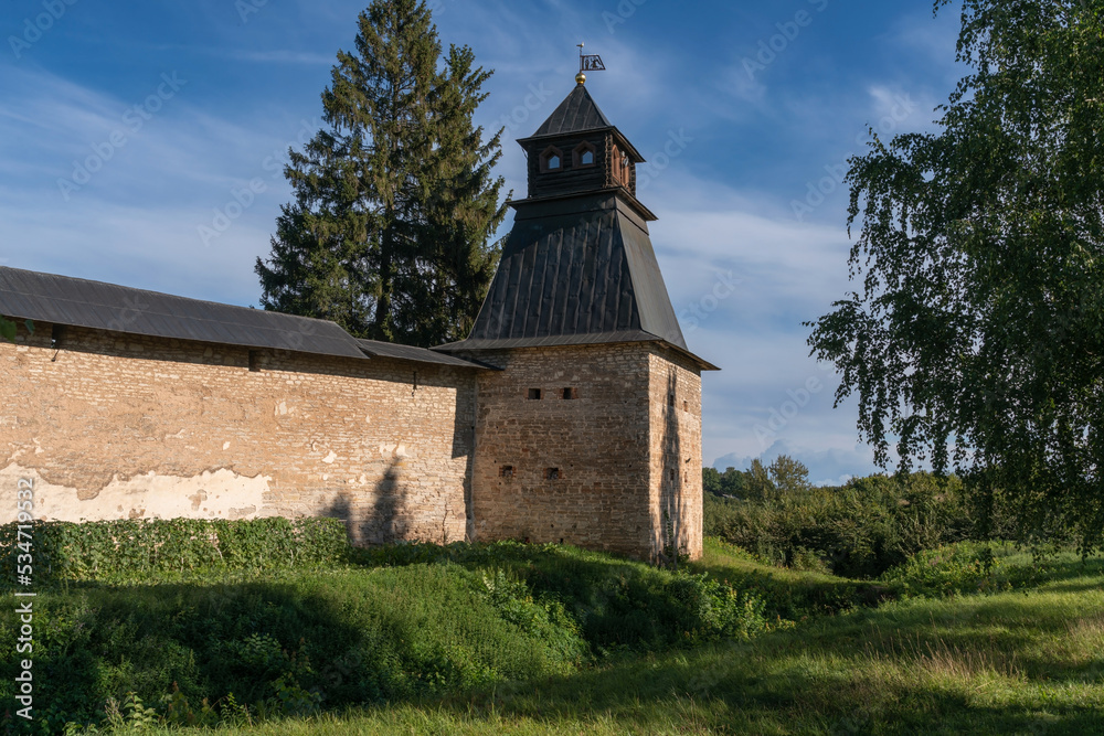 View of the Annunciation Tower of the Holy Dormition Pskov-Pechersk Monastery on a sunny summer day, Pechory, Pskov region, Russia