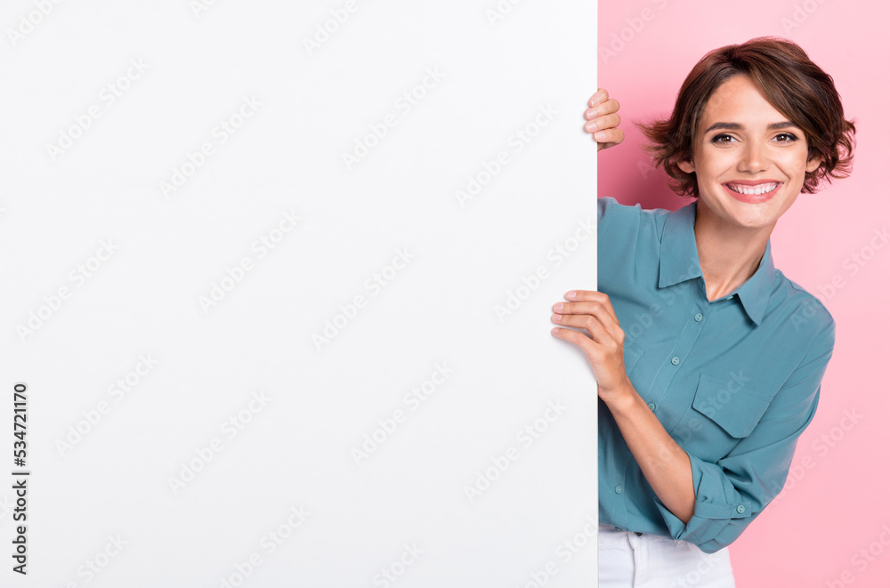 Photo of pretty cheerful lady arm touch hold blank empty space isolated on pink color background Photo of pretty cheerful lady arm touch hold blank empty space isolated on pink color background