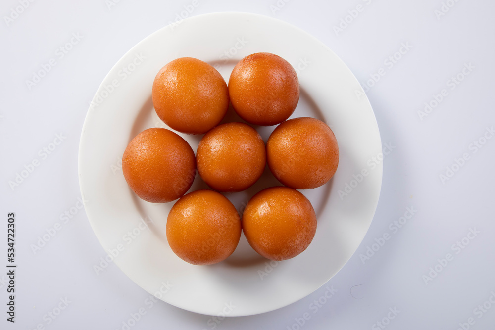 indian sweet gulab jamun closeup view.Sweet Gulab Jamun served in white ceramic bowl. indian sweet gulab jamun closeup view.Sweet Gulab Jamun served in white ceramic bowl.