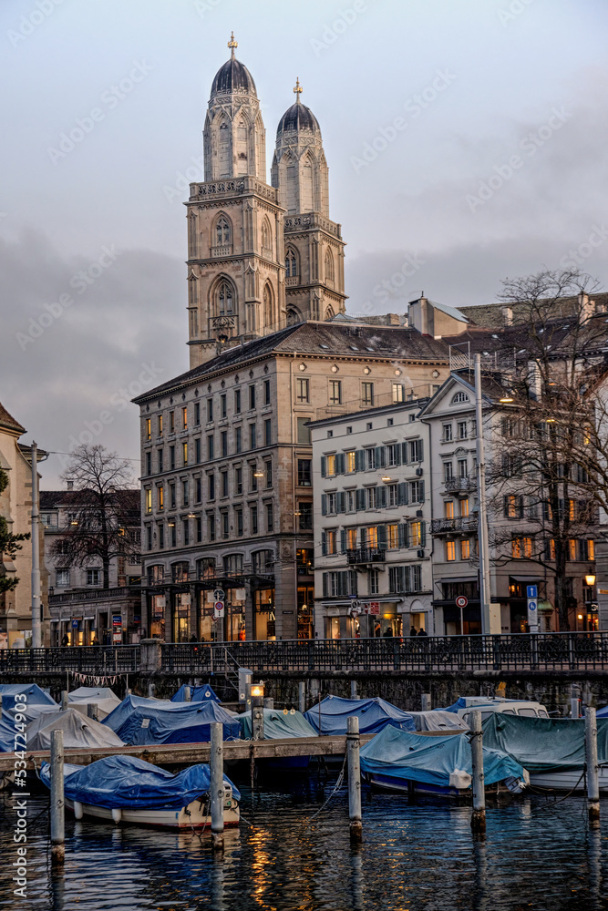 Limmat river in Zurich with Grossmünster cathedral in the back