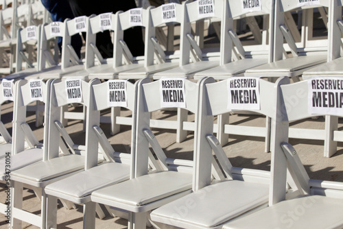 Rows of VIP chairs set up for media