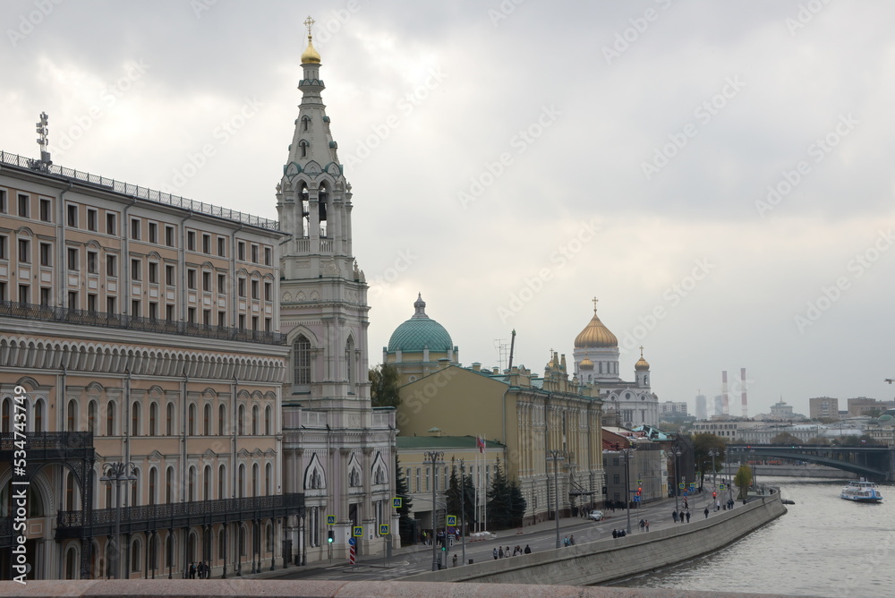 Fototapeta premium Moscow embankment, Old bell tower and church roofs