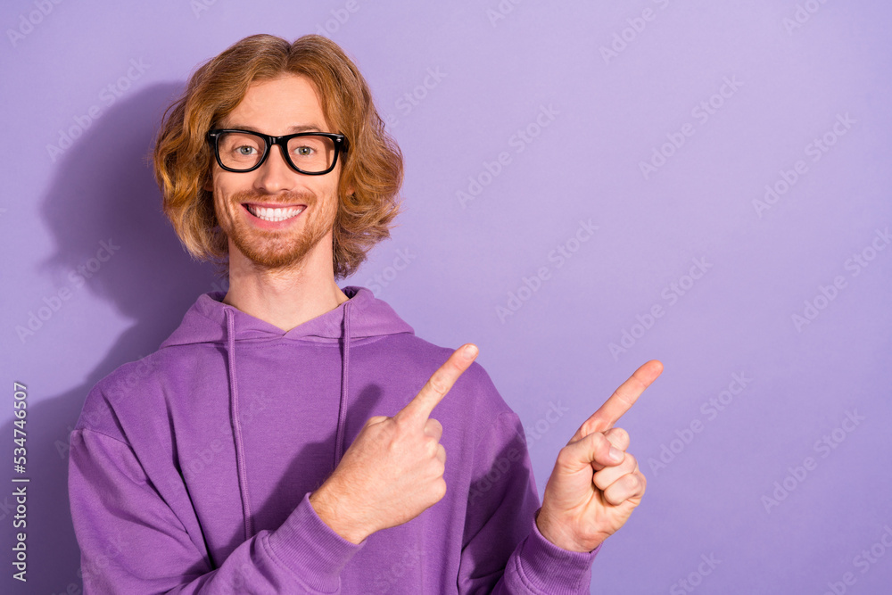 Photo of cool curly orange hairstyle guy indicate promo wear spectacles purple sportcloth isolated on violet color background