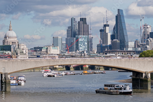 Scene on the river Thames at Waterloo Bridge looking east towards the City of London