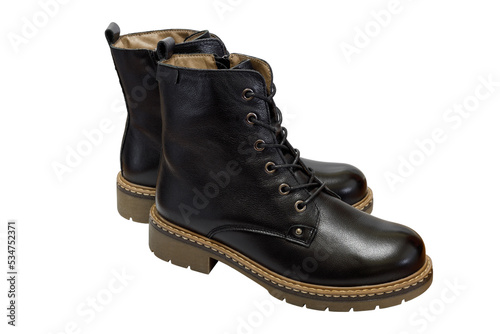 Autumn and winter women's black ankle boots with wool lining isolated on a background.