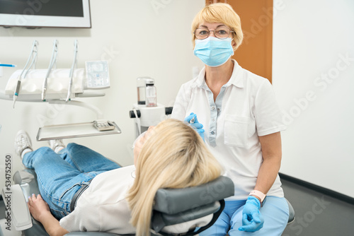 Woman doctor in a mask looking at the camera