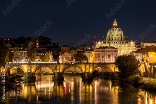 Panoramic View of the Dome of the Basilic of Saint Peter in Rome beside the Bridge on the Tevere River in Rome at Sunset