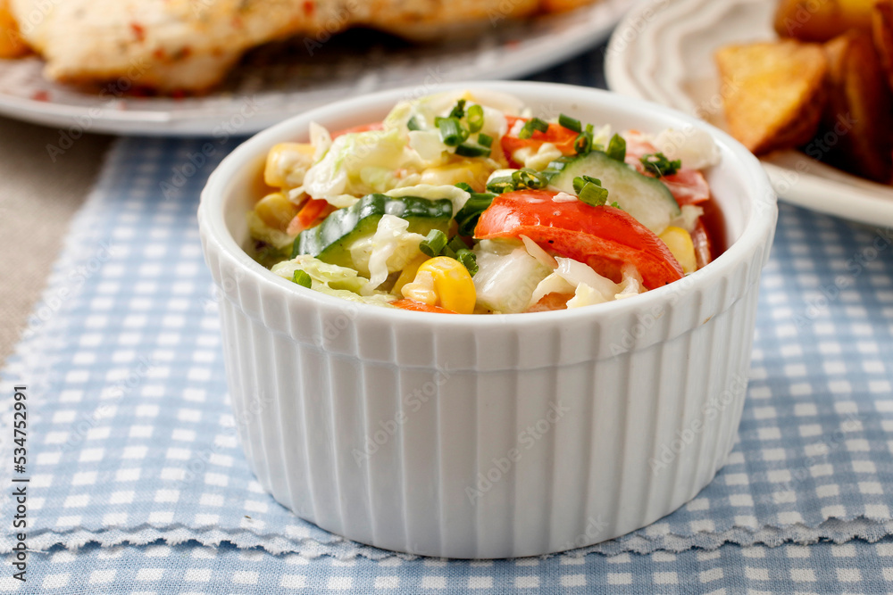 A bowl with vegetable salad. A bowl with vegetable salad.