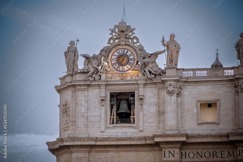 Clock on the Facade of the Basilic of Saint Peter in the Vatican City in the Centre of Rome