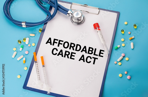 Words Affordable Care Act ACA Tablet. Stethoscope, paper with Affordable Care Act ACA text on the medical table. Medical concept photo