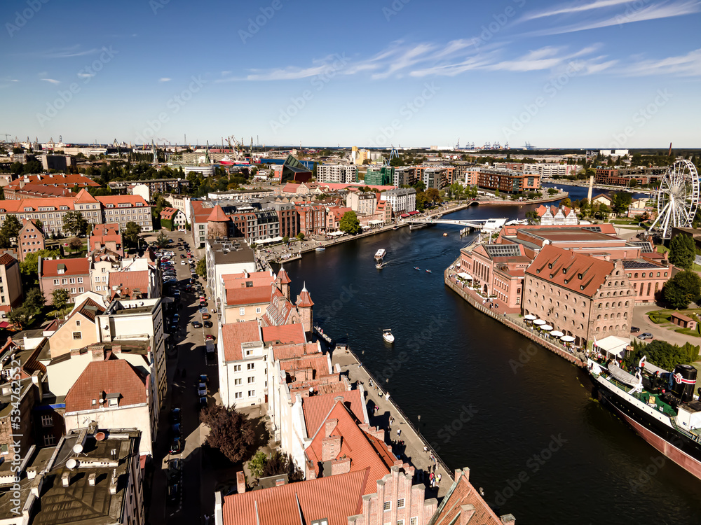View from the drone on the old town of Gdansk on the Motlawa River on a sunny day.