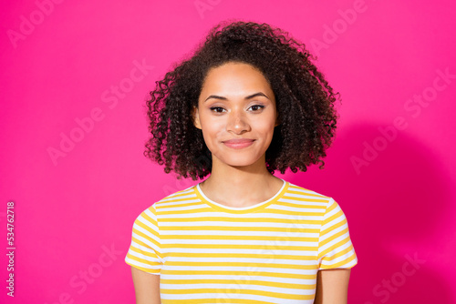 Potrait photo of young positive attractive girl wear striped yellow t-shirt confident smile look you isolated on pink color background © deagreez