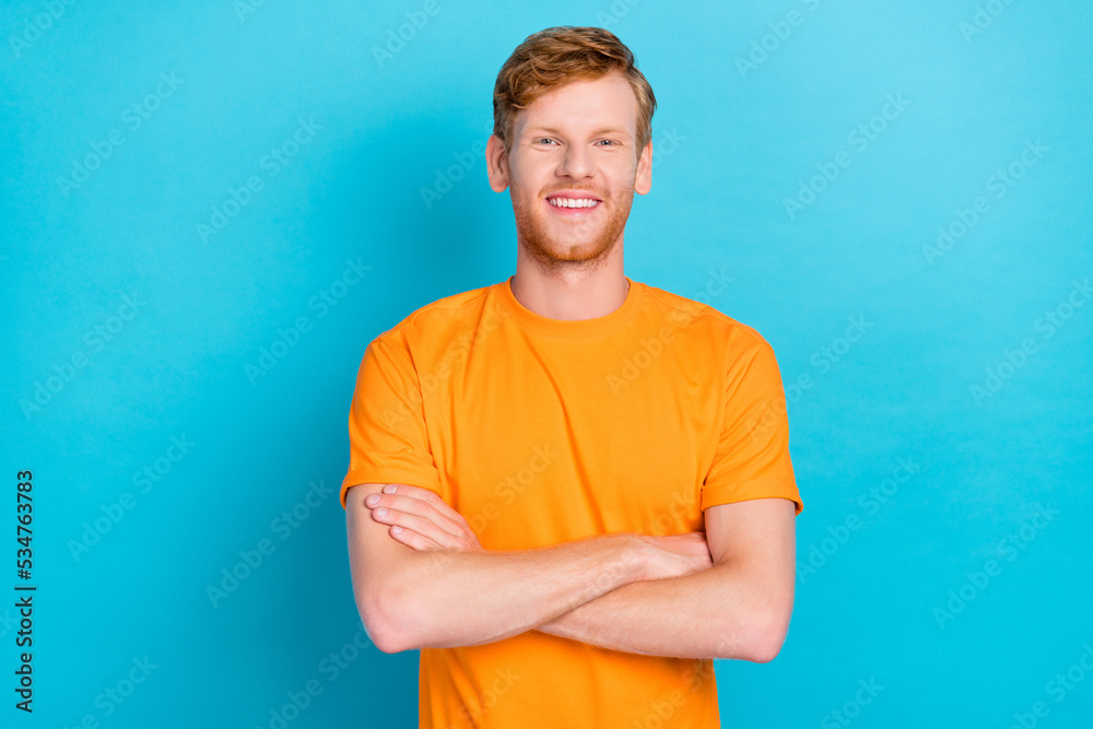 Photo of handsome cheerful satisfied man with ginger hairdo dressed yellow t-shirt arms crossed isolated on turquoise color background Photo of handsome cheerful satisfied man with ginger hairdo dressed yellow t-shirt arms crossed isolated on turquoise color background