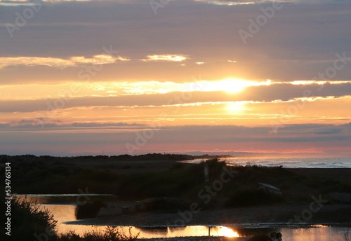 pink sunrise in Camargue over the sea