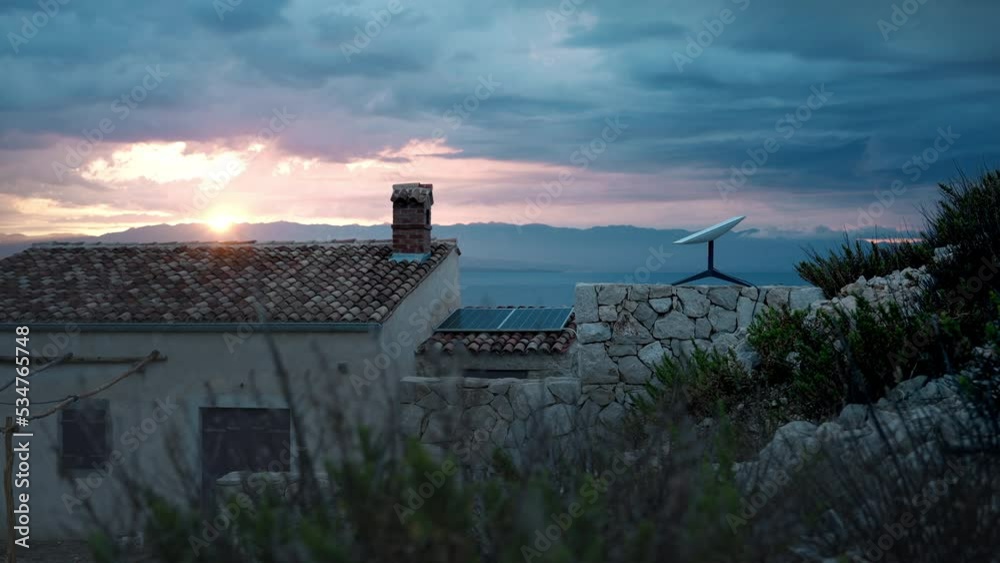 Starlink SpaceX Tesla satellite receiver dish on a fence of