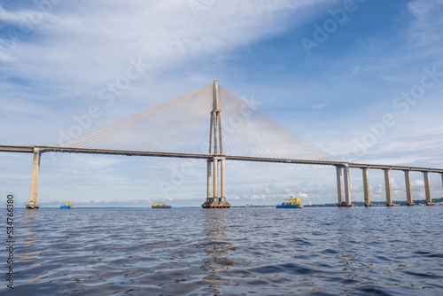 View of Amazonas landscape with Rio Negro Bridge or Ponte Rio Negro, Journalist Phelippe Dahsou Bridge near Manaus in Brazil, Amazonas with blue sky © Zuzana