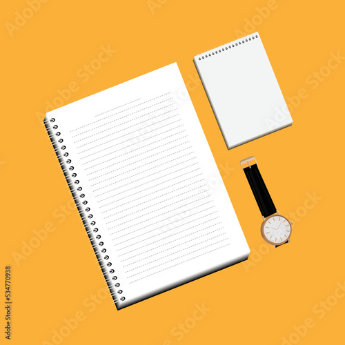  A white lined notebook and a notepad for writing notes are placed next to a wristwatch with a black strap