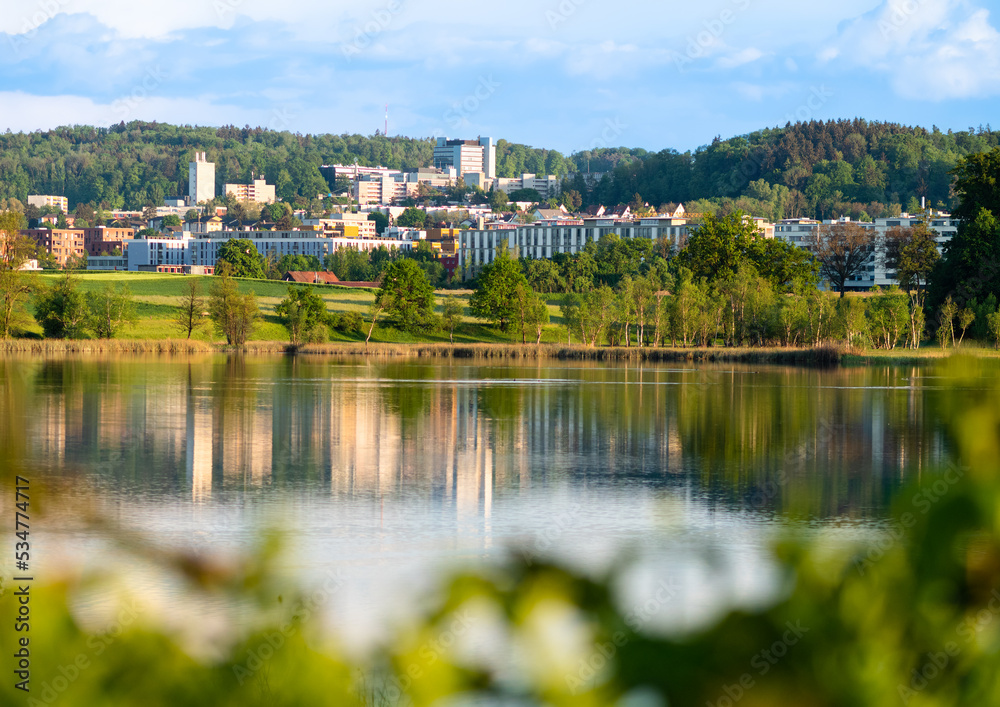 Obraz premium A view of Affoltern in the suburbs of Zurich by the Katzenseen lakes at golden hour