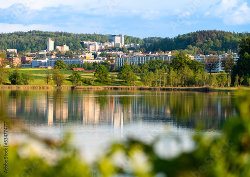 A view of Affoltern in the suburbs of Zurich by the Katzenseen lakes at golden hour © Taljat